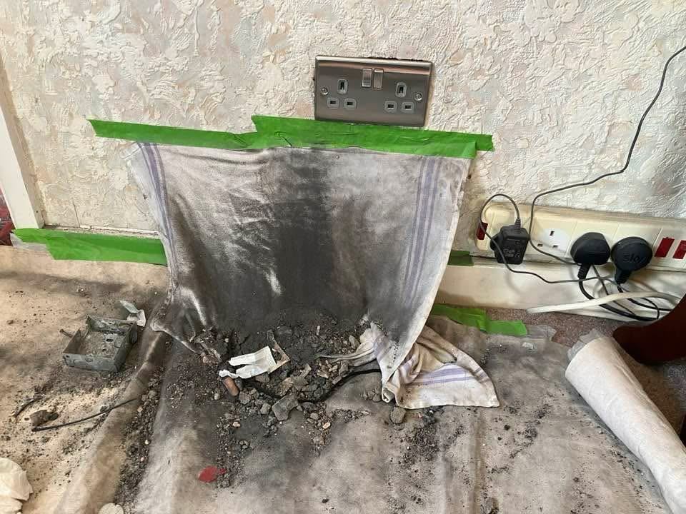 Finished replacement socket on textured wall